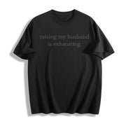 Raising My Husband Is Exhausting Cotton T-Shirt in Black
