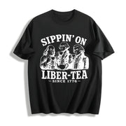George Washington Sippin on Liber-tea Cotton T-Shirt in Black