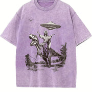Retro Jesus Riding Dinosaur Under UFO Religious Vintage Washed T-Shirt in Purple