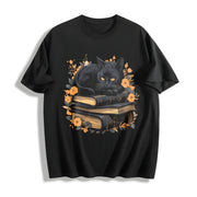 Cat on Book with Autumn Leaves All Seasons Cotton T-Shirt in Black