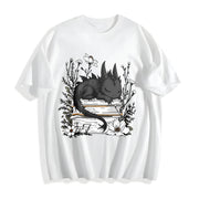 Inspired Whimsical Black Dragon & Floral Book Cotton T-Shirt in White
